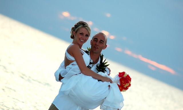 Holding Bride on Beach